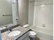 Bathroom with granite counter, bathtub and toilet at 14673 E Belleview Dr, Aurora, CO 80015