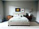 Serene bedroom with neutral tones, a comfortable bed, wooden nightstands, and tasteful wall art, creating a calming atmosphere at 14673 E Belleview Dr, Aurora, CO 80015