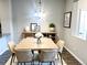 Bright dining room featuring a modern table setting, stylish decor, and contemporary lighting, perfect for gatherings at 14673 E Belleview Dr, Aurora, CO 80015