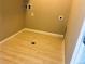 The laundry room features tile flooring, utility connections, and functional layout for efficient laundry tasks at 14673 E Belleview Dr, Aurora, CO 80015
