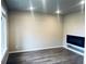 Bright living room with modern fireplace, wood floors and large windows at 14673 E Belleview Dr, Aurora, CO 80015