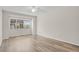 Bright bedroom features modern flooring and natural light from a large window at 12625 E Pacific Cir # E, Aurora, CO 80014