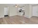 Spacious living room featuring modern flooring and seamless transition to kitchen at 12625 E Pacific Cir # E, Aurora, CO 80014
