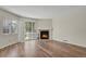 Cozy living room featuring new floors, and a warm fireplace at 12625 E Pacific Cir # E, Aurora, CO 80014