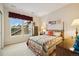 Comfortable bedroom with a quilted bed, natural light, and vintage decor at 24422 E Frost Dr, Aurora, CO 80016