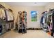 Walk-in closet with ample storage and natural light from the window at 24422 E Frost Dr, Aurora, CO 80016