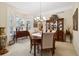 Elegant dining room with hardwood floors, chandelier, and classic furnishings at 24422 E Frost Dr, Aurora, CO 80016