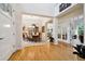 Elegant dining room with hardwood floors, chandelier, and adjacent living spaces at 24422 E Frost Dr, Aurora, CO 80016