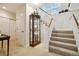 Bright entryway with staircase, display case, and closet for convenient storage at 24422 E Frost Dr, Aurora, CO 80016