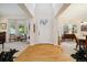 Bright foyer with hardwood floors, high ceilings, and views into adjacent rooms at 24422 E Frost Dr, Aurora, CO 80016