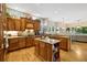Spacious kitchen with island and plenty of cabinet space, leading to a living area at 24422 E Frost Dr, Aurora, CO 80016