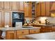 Close-up of the kitchen island with granite counters and built-in storage at 24422 E Frost Dr, Aurora, CO 80016