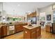 Well-designed kitchen with stainless steel appliances, center island, and open layout at 24422 E Frost Dr, Aurora, CO 80016