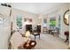 Comfortable living room with bay windows, neutral décor, and ample seating at 24422 E Frost Dr, Aurora, CO 80016