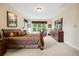 Spacious main bedroom with ample natural light, comfortable bed, and dresser at 24422 E Frost Dr, Aurora, CO 80016