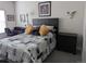 Comfortable bedroom with a wooden headboard, decorative pillows, and a cozy quilt at 6761 Meade Cir, Westminster, CO 80030