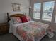 Cozy bedroom with bright natural light and decorative quilt and throw pillows at 6761 Meade Cir, Westminster, CO 80030