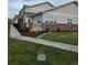 Attractive exterior view with a well-kept lawn, sidewalk, and partial brick facade at 6761 Meade Cir, Westminster, CO 80030