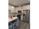 Modern kitchen featuring stainless steel appliances, white countertops, and ample storage space at 6761 Meade Cir, Westminster, CO 80030