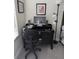 Functional office space with a black desk, comfortable chair, and natural lighting at 6761 Meade Cir, Westminster, CO 80030