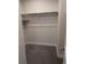 Empty walk-in closet with carpet flooring and shelving at 6761 Meade Cir, Westminster, CO 80030