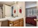 Bathroom featuring a sink vanity and a door to the adjoin bedroom and shower room at 1920 S Hannibal St # B, Aurora, CO 80013