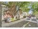 Brick and siding townhome exterior featuring a welcoming front porch and mature shade tree at 1920 S Hannibal St # B, Aurora, CO 80013