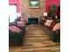 Inviting living room with a brick fireplace, wood floors, and comfortable seating at 1920 S Hannibal St # B, Aurora, CO 80013