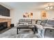 Comfortable living room with plush seating, fireplace, and neutral decor at 1920 S Hannibal St # B, Aurora, CO 80013