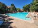 Serene community pool with mature landscaping and lounge chairs for relaxation at 1920 S Hannibal St # B, Aurora, CO 80013