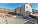 View of backyard with gravel and stone terracing, showcasing a fenced perimeter at 2673 Live Oak Ct, Castle Rock, CO 80104