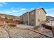 Expansive backyard featuring lush greenery, well-maintained landscaping, rock terrace and privacy fence at 2673 Live Oak Ct, Castle Rock, CO 80104