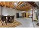 Unfinished basement featuring exposed beams, concrete walls, dining area, sauna and ample space for storage at 2673 Live Oak Ct, Castle Rock, CO 80104