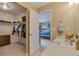Bright ensuite bathroom showcases a walk-in closet, vanity and view into the main bedroom at 2673 Live Oak Ct, Castle Rock, CO 80104