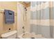 Bathroom featuring a shower/tub combo with white tiles and a blue striped shower curtain, complete with a towel rack at 2673 Live Oak Ct, Castle Rock, CO 80104