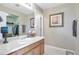 Bathroom features wood vanity, framed mirror, tile flooring and walk-in closet at 2673 Live Oak Ct, Castle Rock, CO 80104