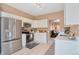 Bright kitchen with stainless steel appliances, white cabinets, and modern countertops at 2673 Live Oak Ct, Castle Rock, CO 80104