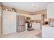 Bright kitchen features stainless steel appliances, ample cabinet space, and modern lighting at 2673 Live Oak Ct, Castle Rock, CO 80104