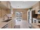 Modern kitchen features quartz countertops, stainless steel appliances and backyard access at 2673 Live Oak Ct, Castle Rock, CO 80104