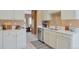Well-lit kitchen featuring stainless steel appliances, white cabinetry, and quartz countertops at 2673 Live Oak Ct, Castle Rock, CO 80104