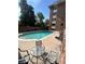Community pool with lounge chairs and seating area for residents to enjoy the outdoors at 1366 Garfield St # 209, Denver, CO 80206