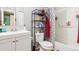 Bathroom with white cabinets, a hard surface floor and shower with patterned curtain at 3623 S Sheridan Blvd # T6, Denver, CO 80235