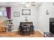 Cozy dining area features neutral walls, laminate flooring, and a modern table with stools at 3623 S Sheridan Blvd # T6, Denver, CO 80235