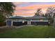 A large, well-maintained backyard with a charming home, garage, and back patio, perfect for outdoor activities at 7780 Osceola St, Westminster, CO 80030
