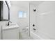 Bathroom featuring black hardware, a tub, shower, and a vanity with sink at 7780 Osceola St, Westminster, CO 80030