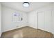 Bedroom boasts hardwood floors, white walls and trim, closet with sliding doors, and a window at 7780 Osceola St, Westminster, CO 80030