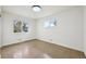 This bedroom has two windows and hardwood floors at 7780 Osceola St, Westminster, CO 80030
