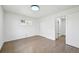 Bright bedroom features hardwood floors, white walls and trim, closet with sliding doors, and natural light at 7780 Osceola St, Westminster, CO 80030