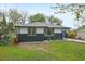 Charming home with a beautiful lawn and a striking two-tone exterior design and landscaping at 7780 Osceola St, Westminster, CO 80030