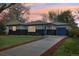 Charming home with a blue door and garage in front of a beautiful lawn and inviting driveway at 7780 Osceola St, Westminster, CO 80030